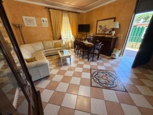 a living room with a couch and a table at Villa Aurea in Avola