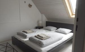 a bedroom with a bed with two pillows on it at Seč Aktivně in Seč