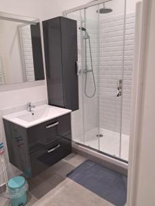 a bathroom with a sink and a shower at Aulta in Ault