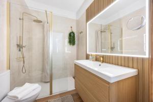 a bathroom with a sink and a shower and a toilet at Casa Alvor in Alvor +39 photos