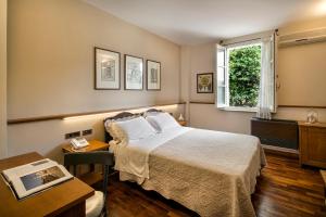 a hotel room with a bed and a window at La Macchia in Spoleto +31 photos
