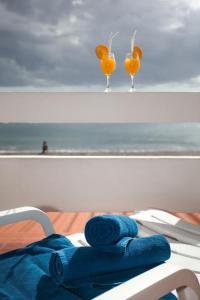 a pair of glasses sitting on top of a table at Aparthotel Barracuda in Ponta Delgada