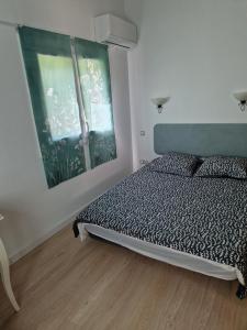 a bedroom with a bed and a window at la roussette in Prats-de-Mollo-la-Preste
