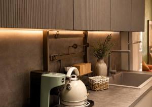 a kitchen counter with a mixer on a counter top at Mareluna Luxury Accomodation in Lampedusa +81 photos