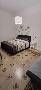 a bedroom with a large bed in a room at Trivia Rent in Reggio di Calabria