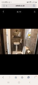 a bathroom with a sink and a toilet at COMFY GUEST suite in Dartford