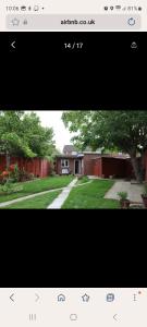 a picture of a yard with a house at COMFY GUEST suite in Dartford