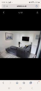 a picture of a living room with a couch at COMFY GUEST suite in Dartford