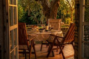 a table and two chairs sitting on a patio at Casa Adele - 10 min from the sea! in Carignano +32 photos