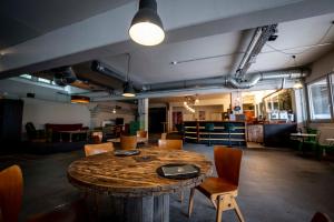 a large room with a wooden table and chairs at Das Boot Triberg in Triberg