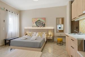 a bedroom with a bed and a sink at Sivotahomes - Noah in Syvota