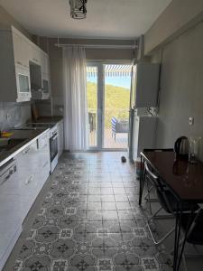 a kitchen with a door leading to a patio at Adrasan village house in Kumluca +19 photos
