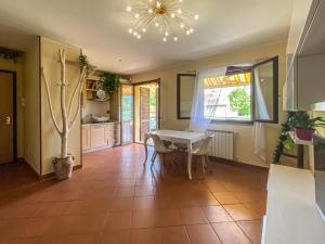 a kitchen and dining room with a table and chairs at Casa Le Marie in Barberino di Mugello