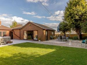 a house with a backyard with a lawn at 1 Bed in Cinderford oc-82884 in Cinderford