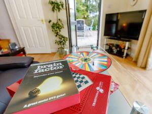 a book sitting on a table in a living room at 1 Bed in Cinderford oc-82884 in Cinderford