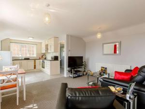 a living room with a couch and a table at 1 Bed in Cinderford oc-88271 in Cinderford
