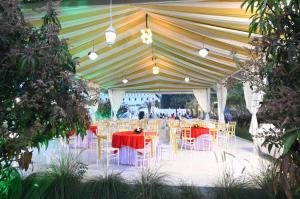 a large tent with tables and chairs under it at WayFare Stud Farm & Resort in Nashik +40 photos