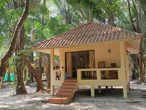 a small house in the middle of a forest at Buffalo Bay Vacation Club in Ko Phayam