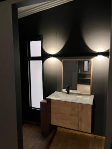 a bathroom with a sink and a mirror at Croxley Farm in Robertson