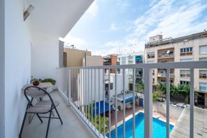 a balcony with a view of a pool and buildings at Cambrils Turistic 3a in Cambrils