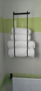 a bunch of towels are hanging in a bathroom at self checkin in Tunis