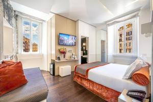 a hotel room with a large bed and windows at Albergo Abruzzi in Rome