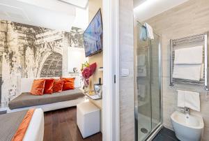 a bathroom with a bed and a shower and a sink at Albergo Abruzzi in Rome +229 photos