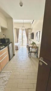 a kitchen with a table and a dining room at Jaystaycation in Iloilo City