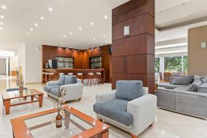 a living room with two couches and a table at Stefania Hotel by Anayia All Inclusive Resorts in Amarynthos