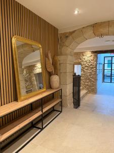 a large mirror on a wall in a room at Casa Tramuntana in El Port de la Selva