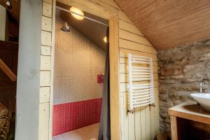 a bathroom with a shower and a sink at Divas Upes SPA hotel Koknese in Koknese +131 photos