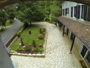an overhead view of a garden next to a building at Auberge de la Sagne in Cabrerets