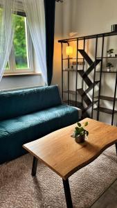 a living room with a couch and a coffee table at podZZamkem in Jaroslavice
