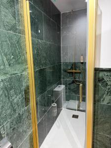 a bathroom with a shower with a toilet in it at Boutique Hotel Castilla in Soria +48 photos