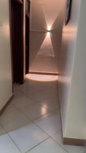 a room with a light inside of a refrigerator at Malaika Villas in Kampala