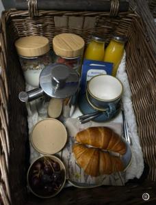 a basket filled with different types of food and bread at The Old Library in Arisaig