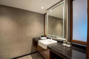 a bathroom with a sink and a mirror at Radisson Hotel Sonamarg in Sonāmarg +37 photos