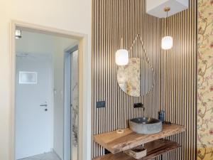 a bathroom with a sink on a wooden table at Pension Votsi in Votsi +142 photos