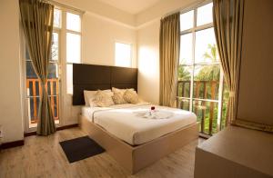 Postel nebo postele na pokoji v ubytování Express Inn at Hulhumale