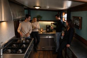 a group of people standing in a kitchen at Zeilschip de Alliantie Kampen in Kampen +7 photos