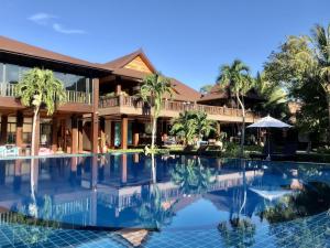a view of a resort with a swimming pool at Phi Phi Villa Resort in Phi Phi Islands