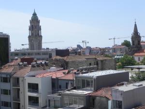 a view of a city with a clock tower at Bolhão Skyline in Porto