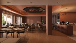a restaurant with tables and chairs and a bar at stuub jostal in Titisee-Neustadt