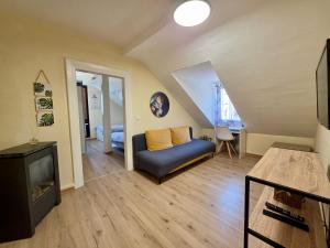 a living room with a couch and a fireplace at Kamus in Baden-Baden