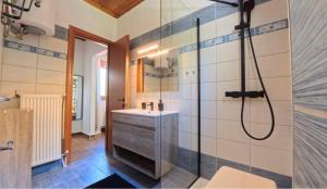 a bathroom with a sink and a shower at Villa del Vino in Mikrós Prínos +26 photos