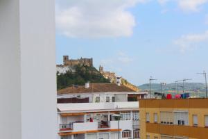 a castle on top of a hill with buildings at La Duquesita - Ideal para escapada en pareja in Arcos de la Frontera