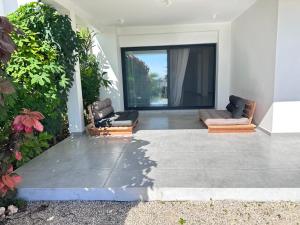 a living room with two couches in a house at Didas Villa Zanzibar in Zanzibar City +13 photos