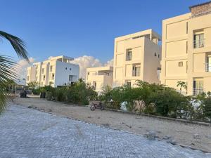 a bike is parked in front of some buildings at Didas Villa Zanzibar in Zanzibar City