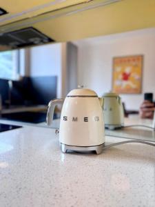 a tea kettle sitting on top of a counter at Hello Bronte! in Sydney +8 photos