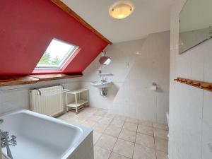 a bathroom with a white tub and a sink at Platschorre in Oudelande +29 photos